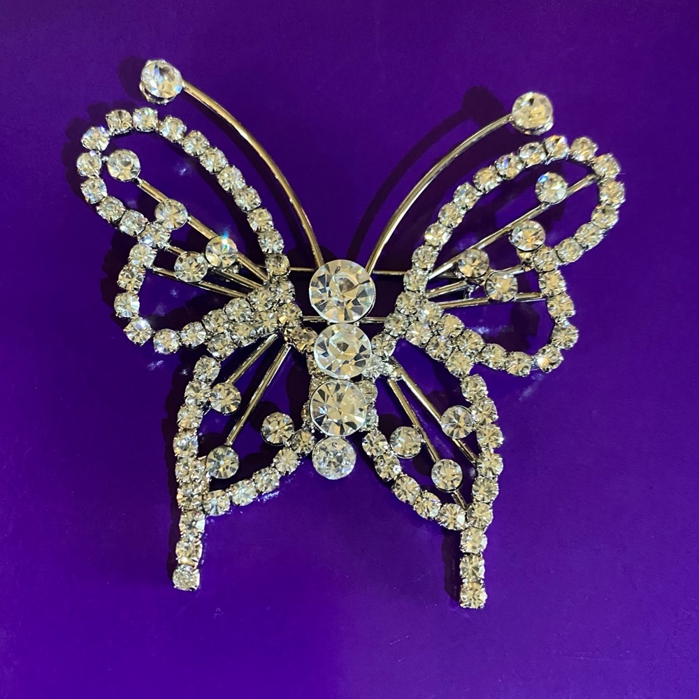 Butterfly brooch/pin with clear rhinestones.